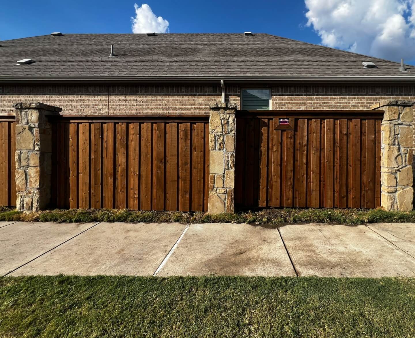 Wood Fence with Stone Columns